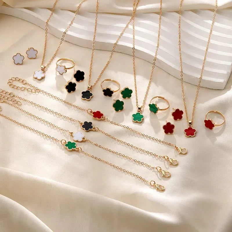 Delicate Floral Clover Jewelry Set: Necklace, Bracelet, Earrings, and Rings