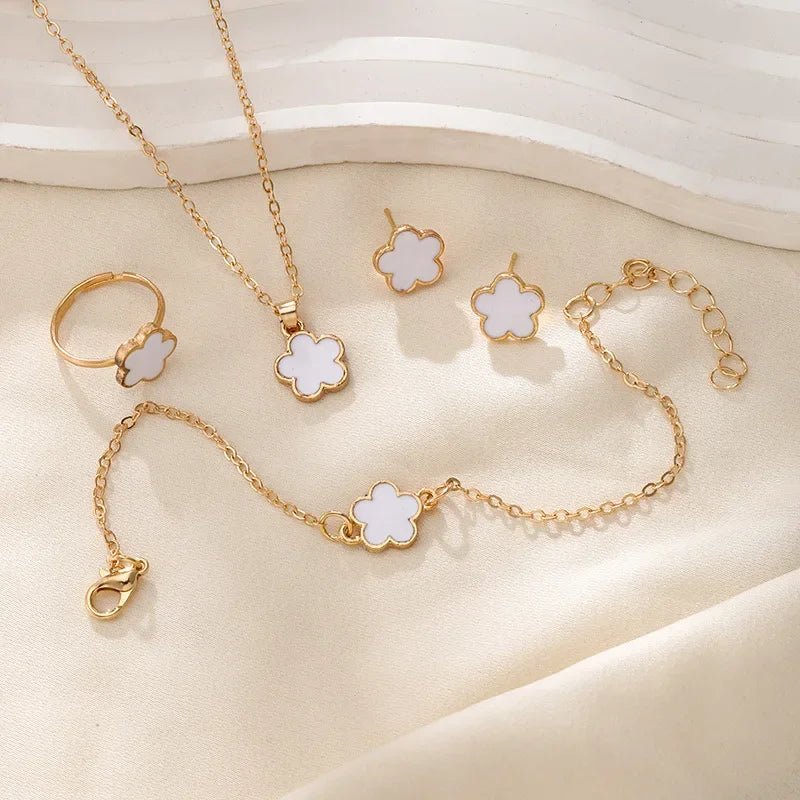 Delicate Floral Clover Jewelry Set: Necklace, Bracelet, Earrings, and Rings