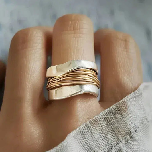 Silver Ring Featuring a Golden Thread Pattern