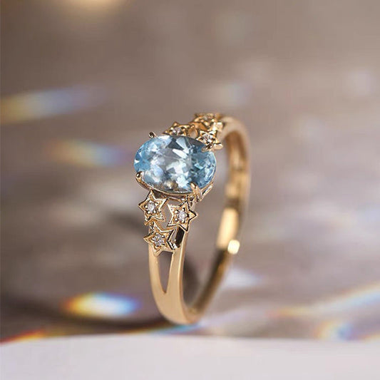 Premium Gold Ring Featuring a Blue Crystal Accent