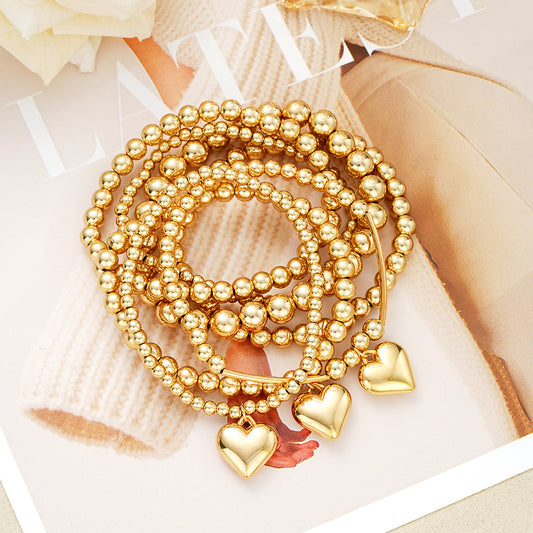 Set of 7 Gold Beaded Heart Charm Bracelets