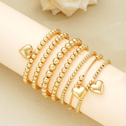 Set of 7 Gold Beaded Heart Charm Bracelets